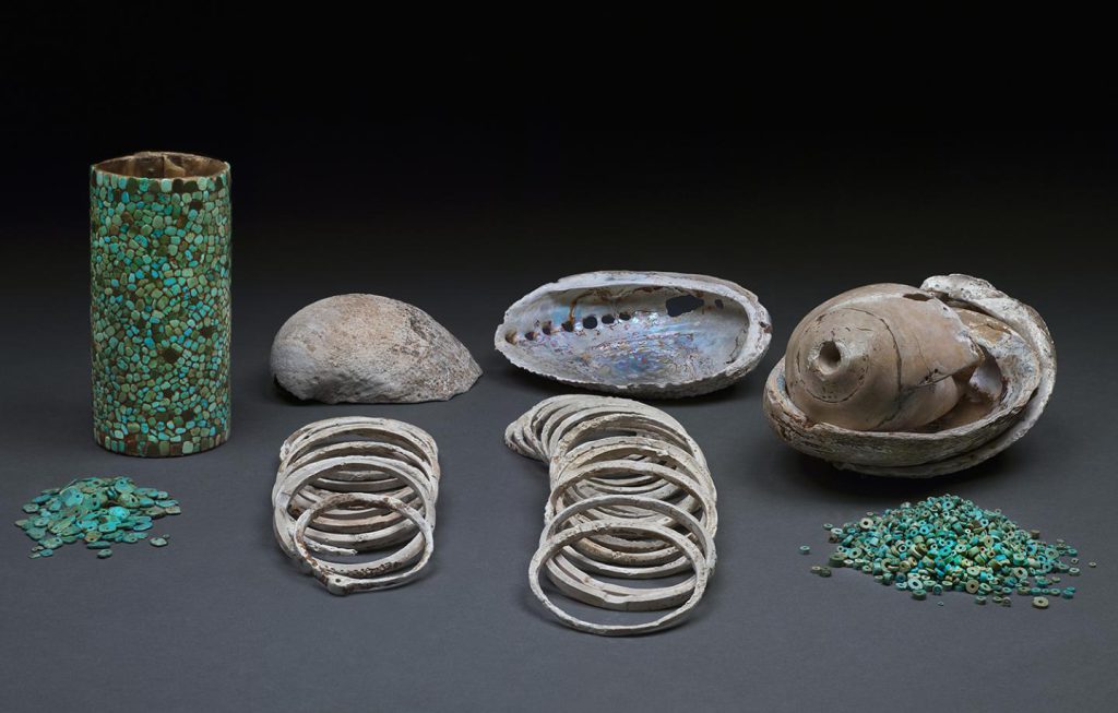 Chaco canyon NAGPRA - Turquoise beads, shell bracelets, haliotis shells, and a mosaic cylinder basket were among the artifacts found with the remains in the Pueblo Bonito burial crypt.